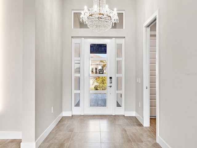 entryway with an inviting chandelier