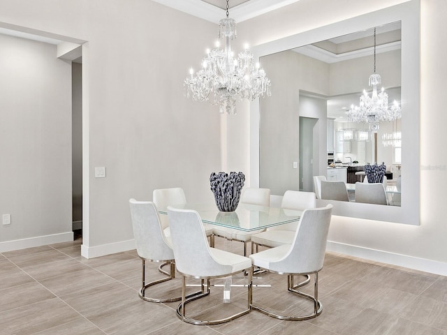 tiled dining room featuring a chandelier, a raised ceiling, and ornamental molding