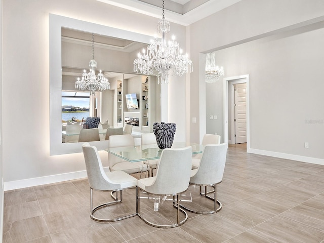 dining space featuring a notable chandelier, a raised ceiling, a towering ceiling, and ornamental molding