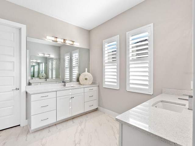 bathroom with a wealth of natural light and vanity