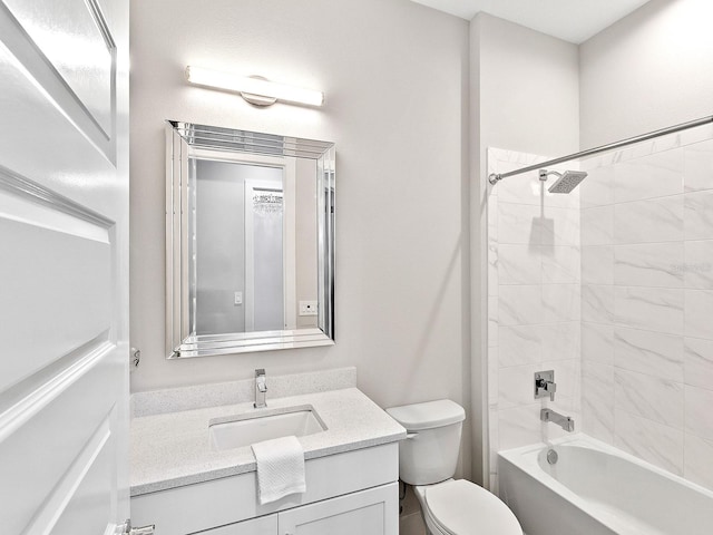 full bathroom with vanity, toilet, and tiled shower / bath