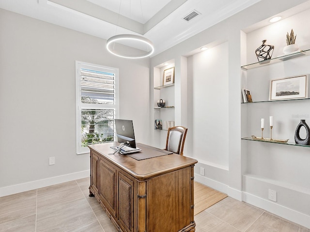 tiled office with a tray ceiling and built in features