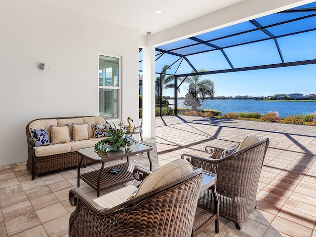 view of patio / terrace featuring outdoor lounge area, a water view, and a lanai