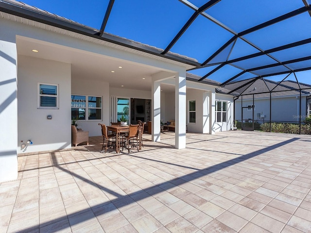 view of patio / terrace featuring a lanai