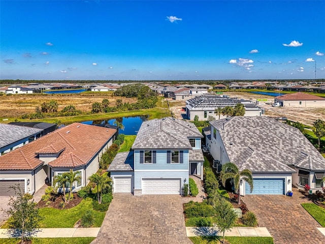 aerial view with a water view and a residential view