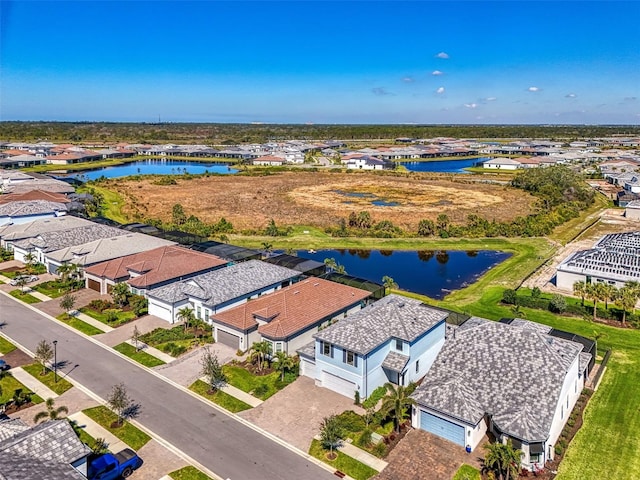 aerial view with a water view and a residential view