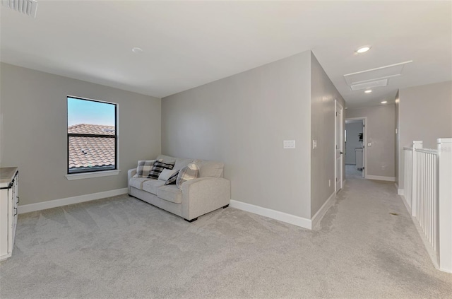 sitting room with attic access, visible vents, baseboards, light colored carpet, and recessed lighting