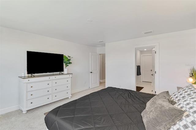 bedroom with light carpet, visible vents, and baseboards