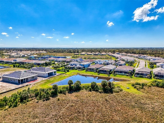 aerial view featuring a water view and a residential view