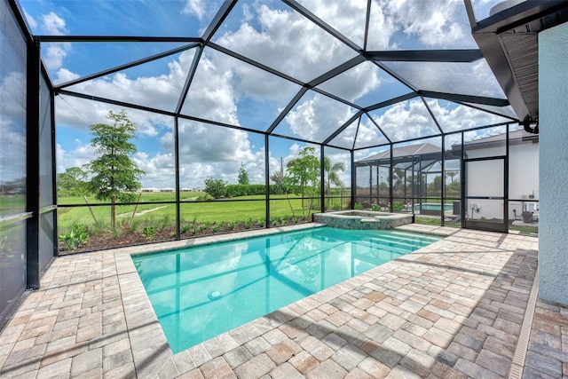 view of pool featuring glass enclosure, a patio area, and a pool with connected hot tub