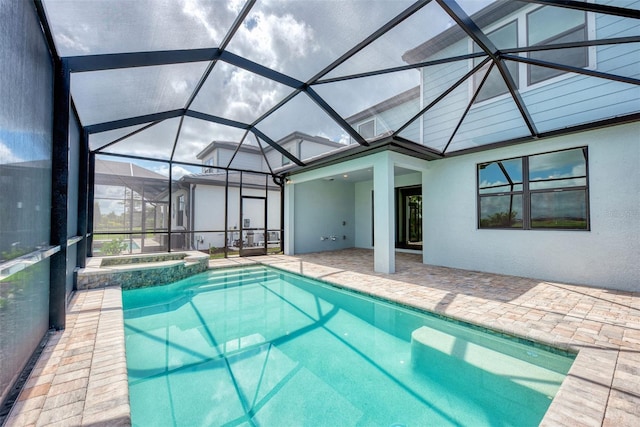 view of swimming pool with a lanai, a patio area, and a pool with connected hot tub