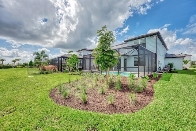 view of yard with a lanai and an outdoor pool