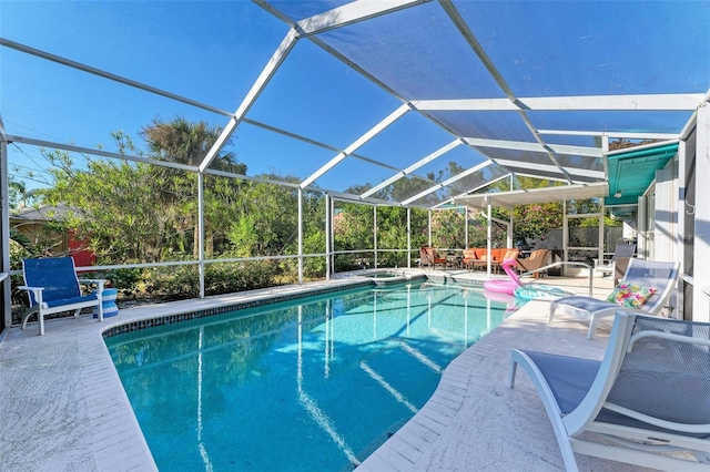 view of pool featuring a lanai and a patio area