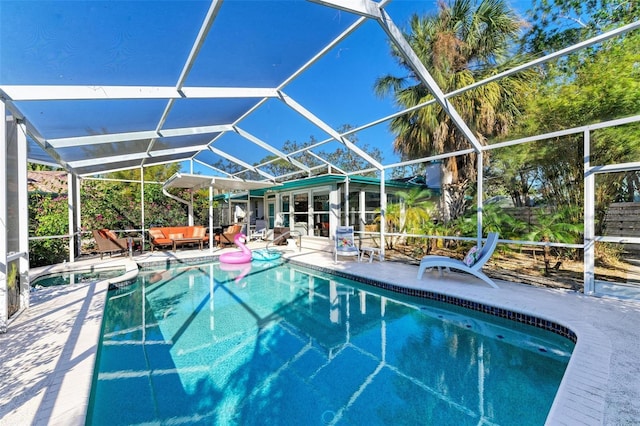 view of swimming pool featuring a lanai, an outdoor living space, and a patio