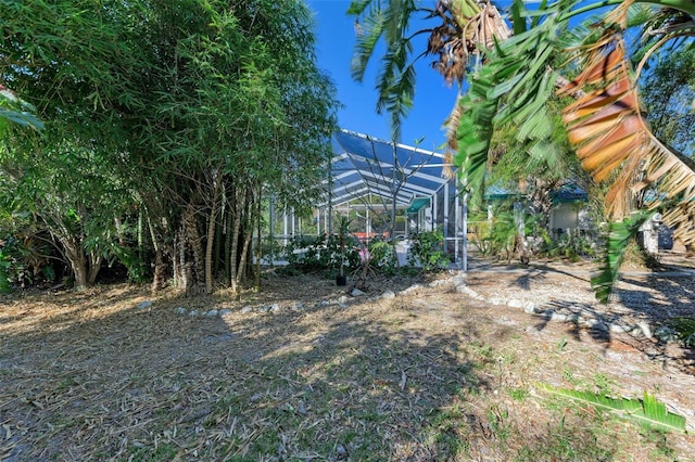 view of yard featuring a lanai