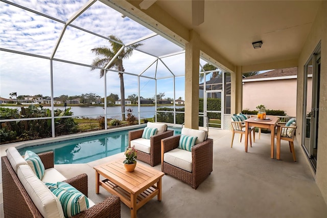 view of patio / terrace with glass enclosure, a water view, and an outdoor hangout area