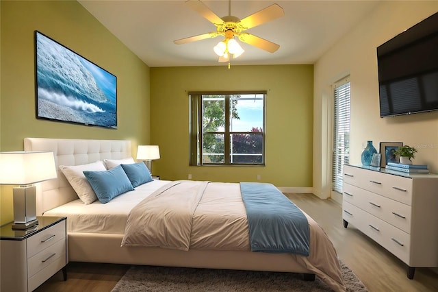 bedroom with ceiling fan and light hardwood / wood-style floors