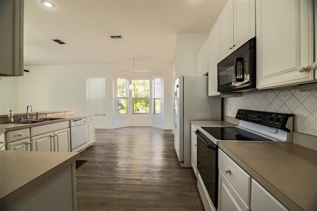 kitchen featuring dark hardwood / wood-style flooring, white cabinets, sink, electric stove, and dishwasher