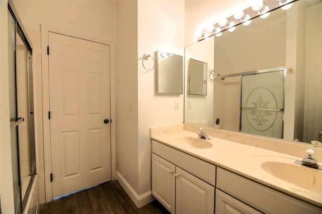 bathroom with wood-type flooring and vanity