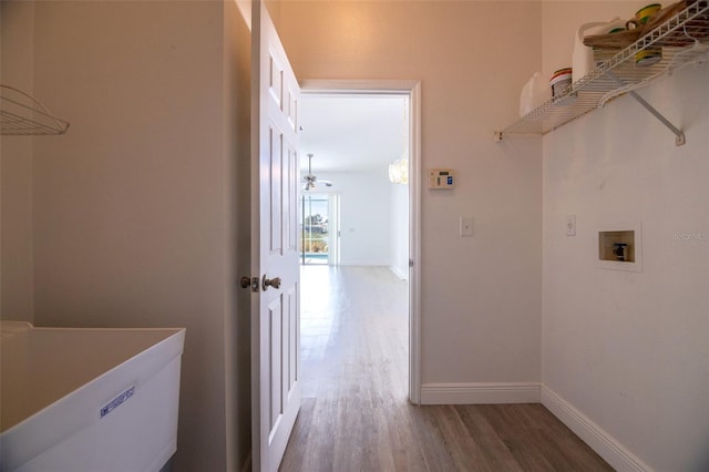 clothes washing area with washer hookup, ceiling fan, and wood-type flooring