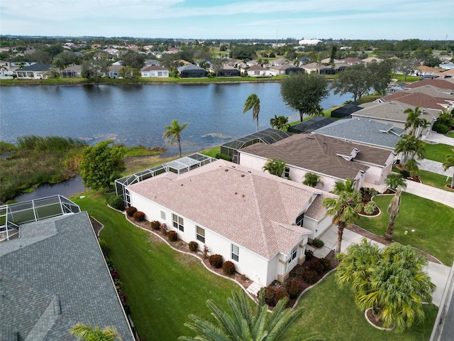 birds eye view of property with a water view