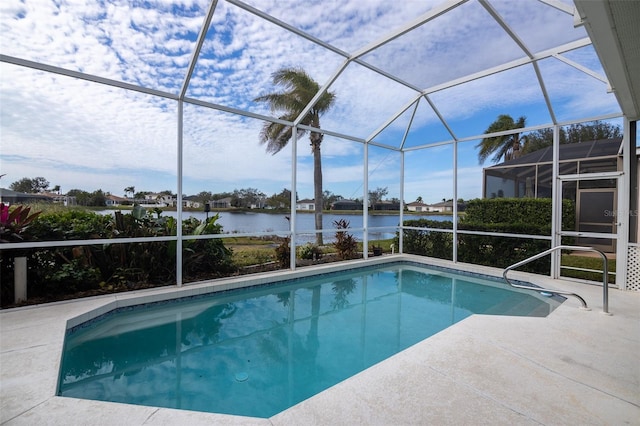 view of swimming pool featuring a water view, glass enclosure, and a patio area