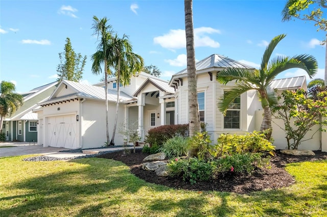 view of front facade featuring a garage and a front lawn