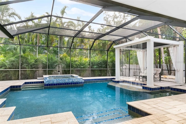 view of swimming pool featuring an in ground hot tub, pool water feature, a patio, and glass enclosure