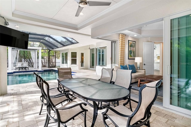 view of patio / terrace with glass enclosure, ceiling fan, and an outdoor hangout area