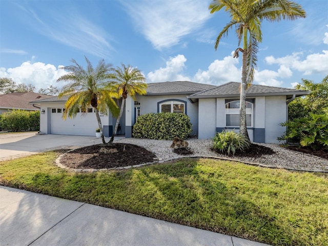 view of front of house featuring a front yard and a garage