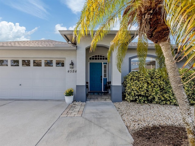 view of front of property with a garage