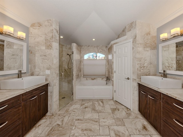 bathroom with independent shower and bath, crown molding, vanity, and tile walls