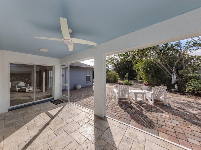 view of patio featuring ceiling fan