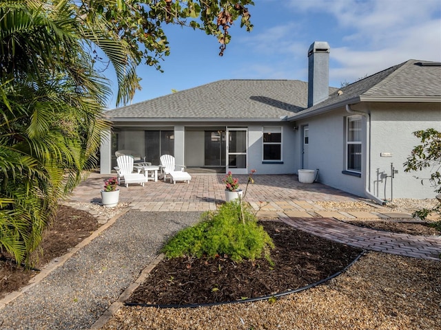 back of house featuring a patio