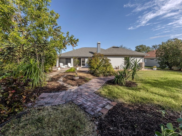 view of front of home featuring a patio area and a front lawn