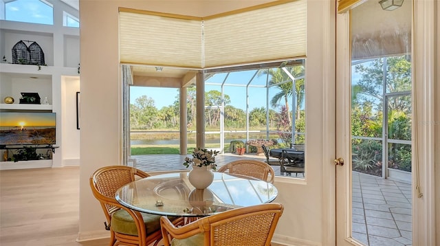 sunroom with a water view