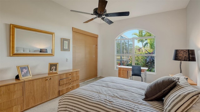 bedroom with ceiling fan and light colored carpet