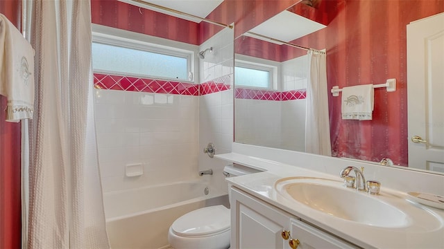 full bathroom featuring shower / tub combo, vanity, and toilet