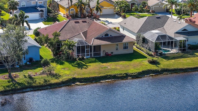 birds eye view of property featuring a water view