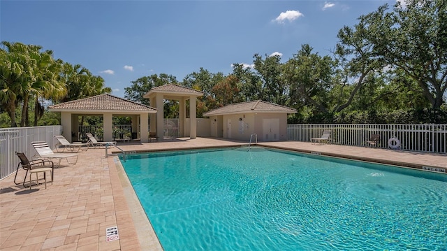 view of swimming pool with a gazebo and a patio area