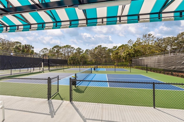 view of tennis court featuring basketball court