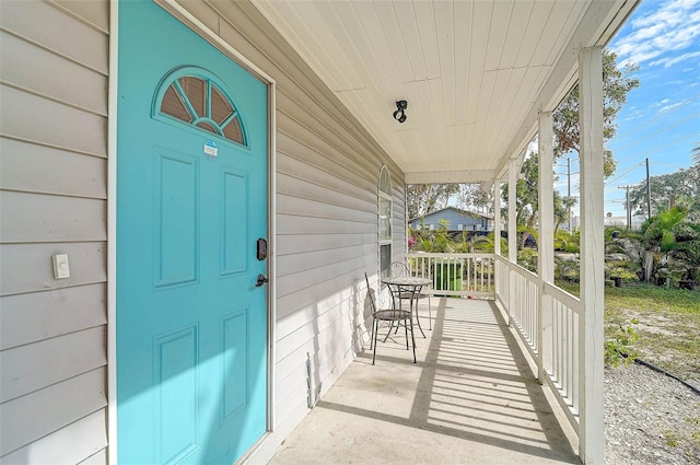 doorway to property with a porch