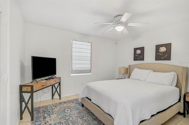 tiled bedroom with ceiling fan