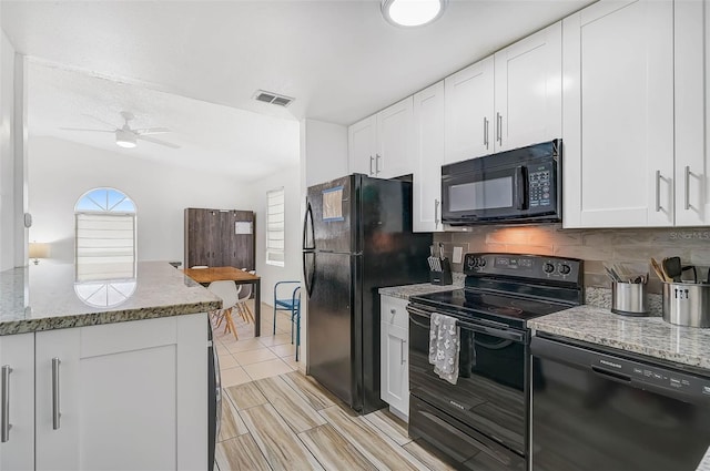 kitchen featuring decorative backsplash, light stone counters, ceiling fan, black appliances, and white cabinetry