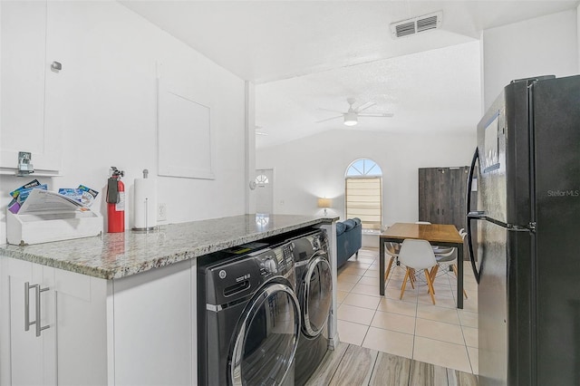 clothes washing area with ceiling fan, separate washer and dryer, and light tile patterned floors