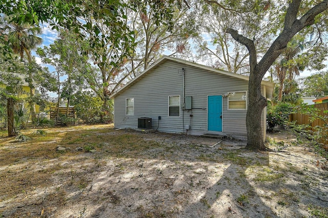 back of property featuring central air condition unit