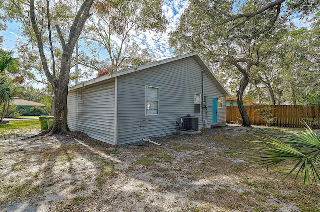 rear view of house with central air condition unit