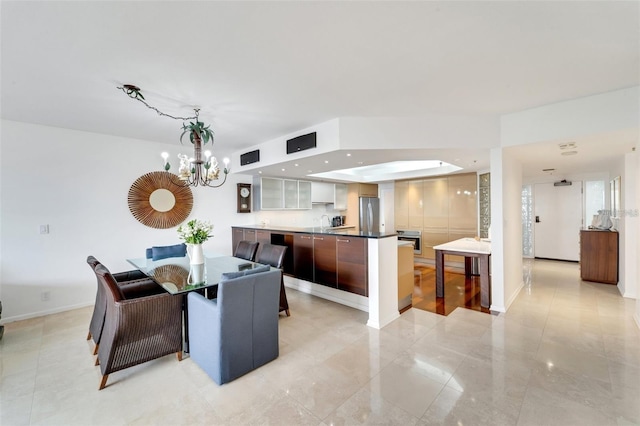 dining space featuring a chandelier