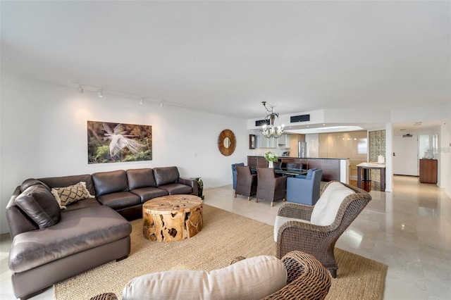 living room with a notable chandelier