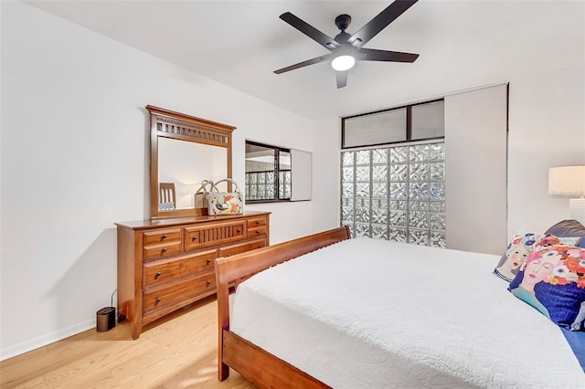 bedroom featuring ceiling fan and hardwood / wood-style flooring